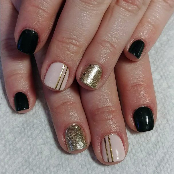 Classy Black And Gold Nails