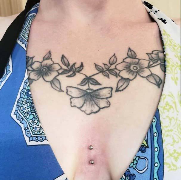 Classy Floral Chest Tattoo Design Vertical Scoop Unique Piercing Ideas For Girls