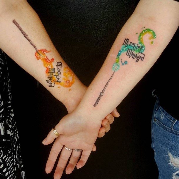 Colorful Couple Tattoo Forearms