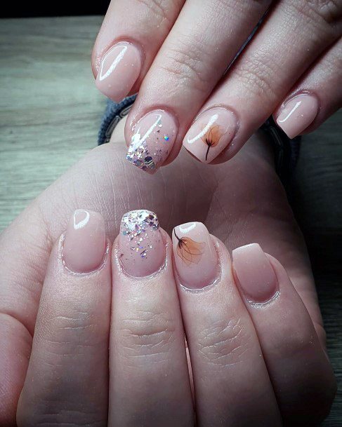 Colorful Glitters And Feathered Plant Art On Nude Nails For Women