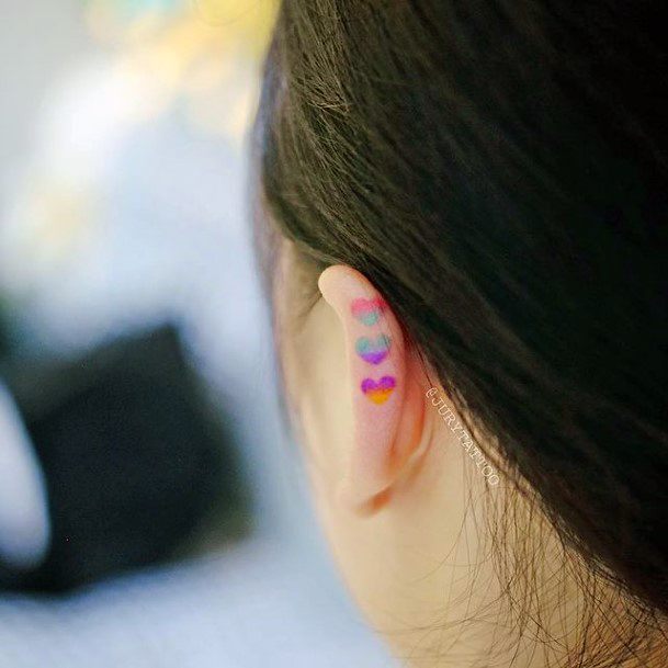 Colorful Small Hearts On Earlobe Tattoos For Women