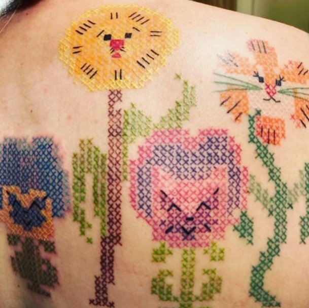 Cool Female Cross Stitch Tattoo Designs