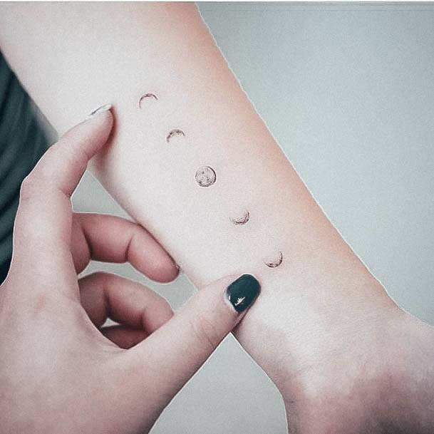 moon phases tattoo wrist