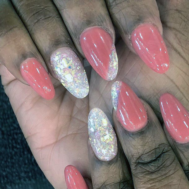 Coral Pink With Glitters Almond Nails