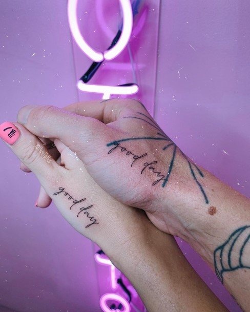 Couple Good Day Quote Tattoo Hands