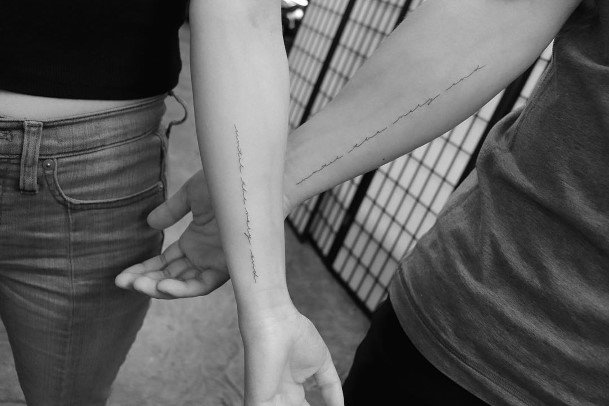 Couples Cursive Writing Tattoo Forearms