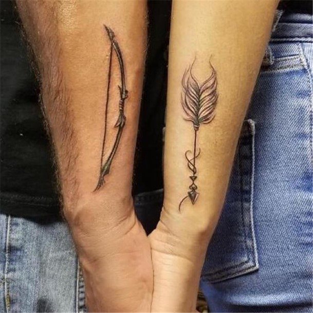 Couples Feathered Arrow And Bow Tattoo Forearms