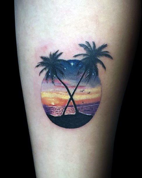 Crossed Pair Of Palm Trees Tattoo Women