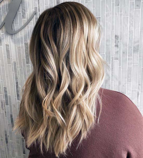 Curly Blonde And Brown Hairstyle For Women Spring