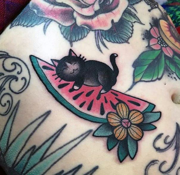 Cute Black Cat And Green Leafy Plants Tattoo For Women