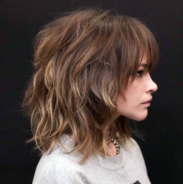 Cute Voluminous Textured Brown And Blonde Highlighted Shag Womens Hairstyle