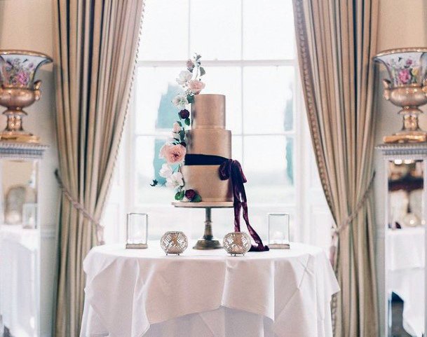 Dark Bow Tie On Gold Wedding Cake