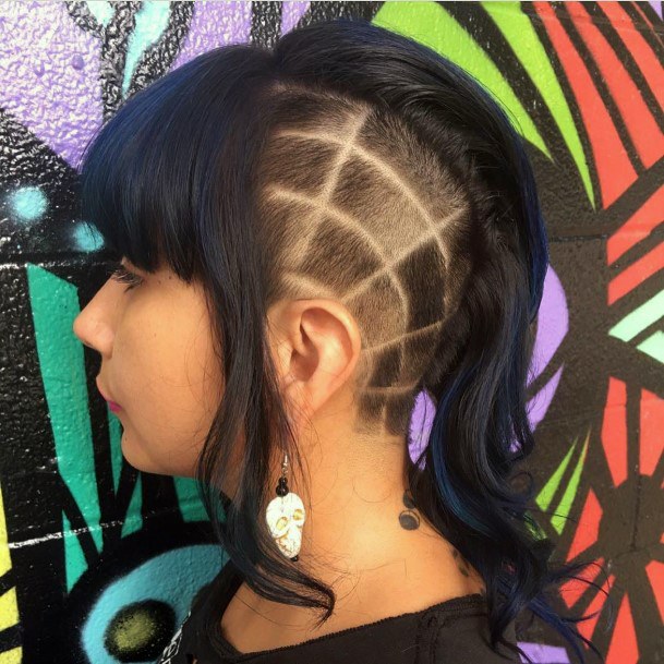 Dark Haired Young Girl With Short Sharp Designs With Mohawk Hairstyle