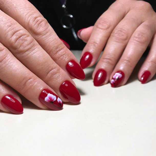 Dark Rich Red Shellac Nails With White Floral Accent For Women