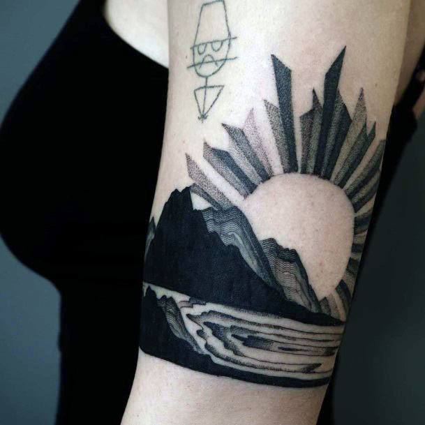 Dark Tattoo Of Brilliant Sun Over Hills Women