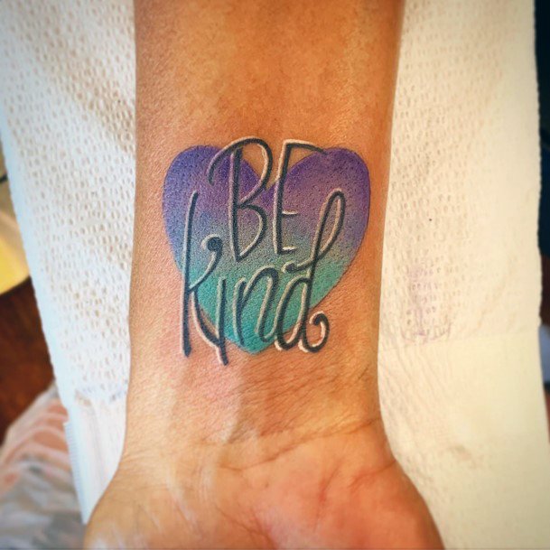 Decorative Be Kind Tattoo On Female