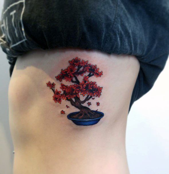 Decorative Bonsai Tattoo On Female