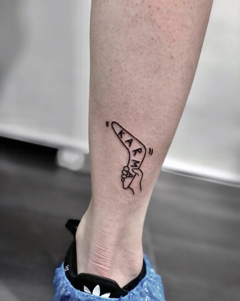 Decorative Boomerang Tattoo On Female