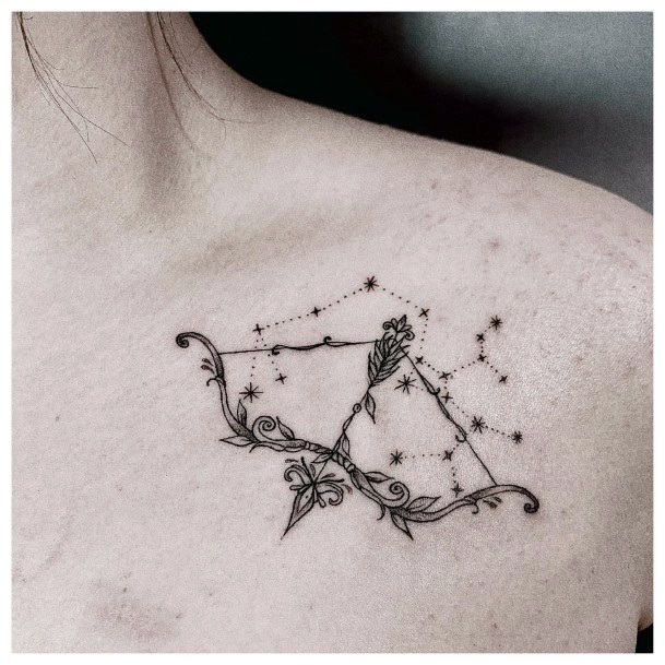 Decorative Bow And Arrow Tattoo On Female