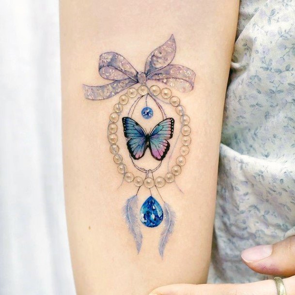 Decorative Bow Tattoo On Female