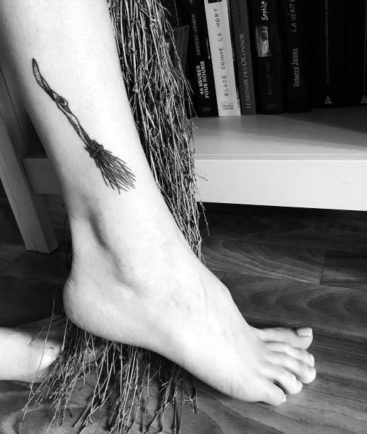 Decorative Broomstick Tattoo On Female