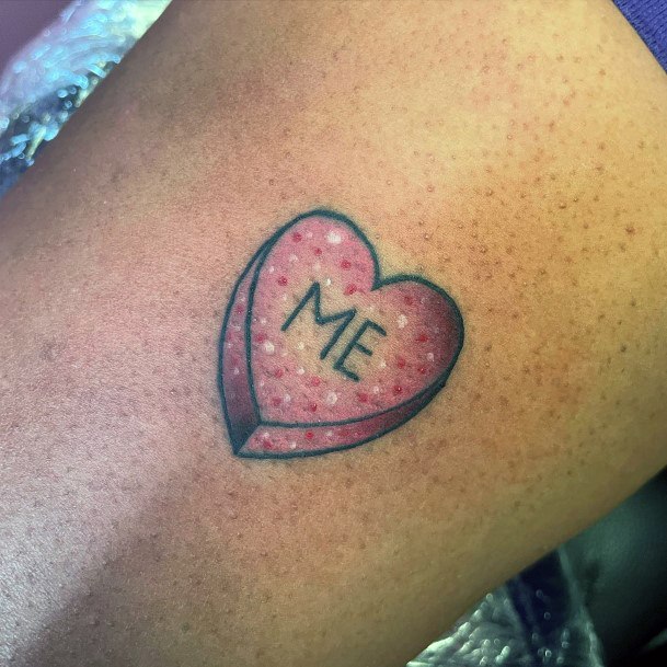 Decorative Candy Heart Tattoo On Female