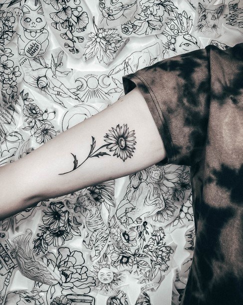 Decorative Daisy Tattoo On Female