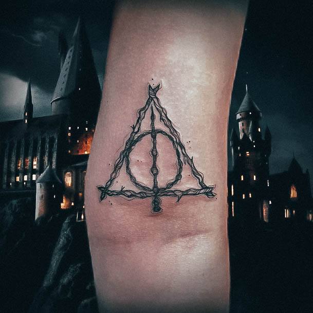 Decorative Deathly Hallows Tattoo On Female