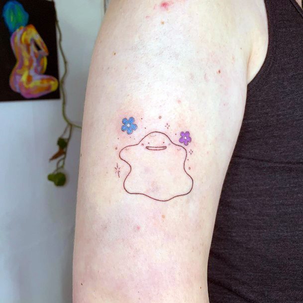 Decorative Ditto Tattoo On Female