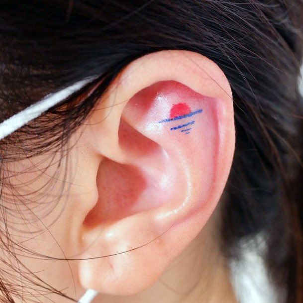 Decorative Ear Tattoo On Female