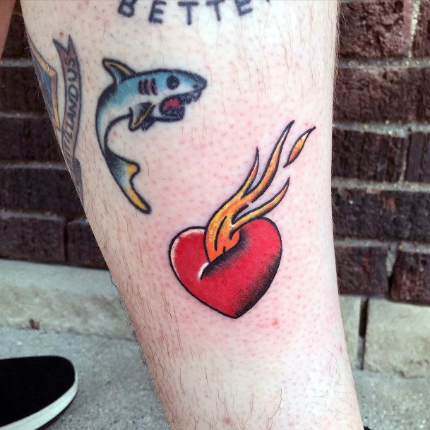 Decorative Flaming Heart Tattoo On Female