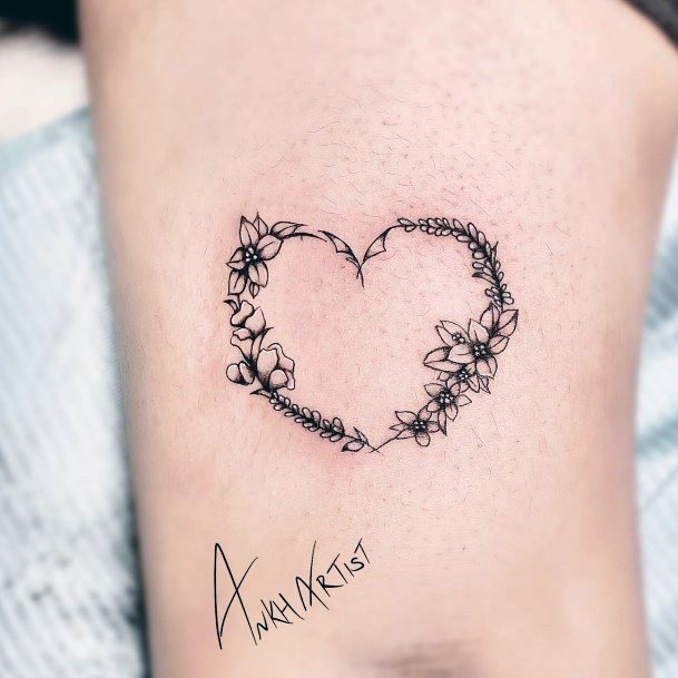 Decorative Flower Heart Tattoo On Female