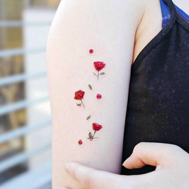 Decorative Flower Petal Tattoo On Female