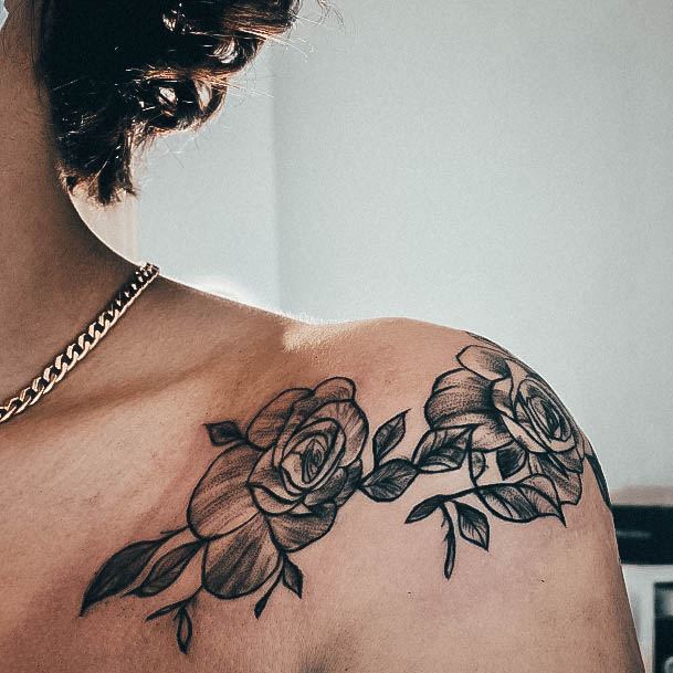 Decorative Flower Shoulder Tattoo On Female