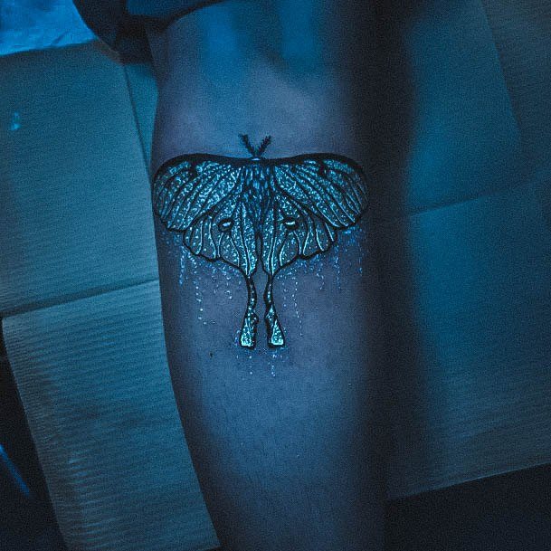 Decorative Glow In The Dark Tattoo On Female Moth