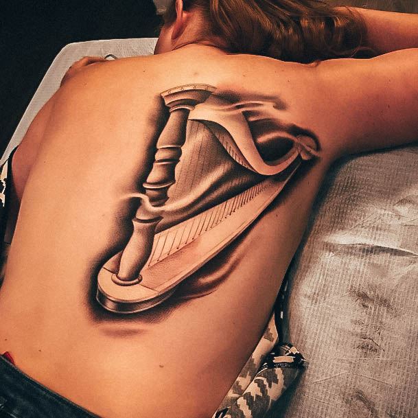 Decorative Harp Tattoo On Female