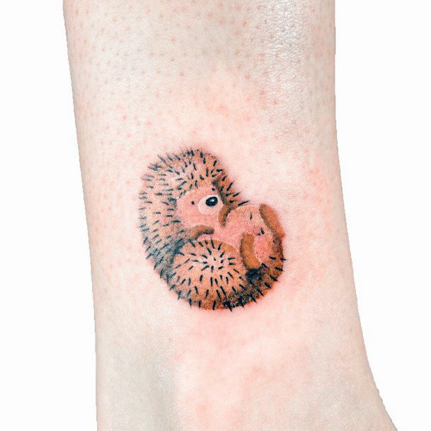 Decorative Hedgehog Tattoo On Female