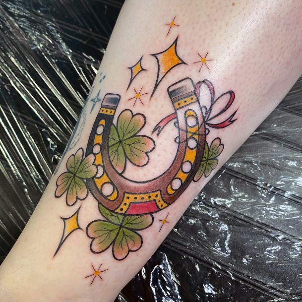 Decorative Horseshoe Tattoo On Female