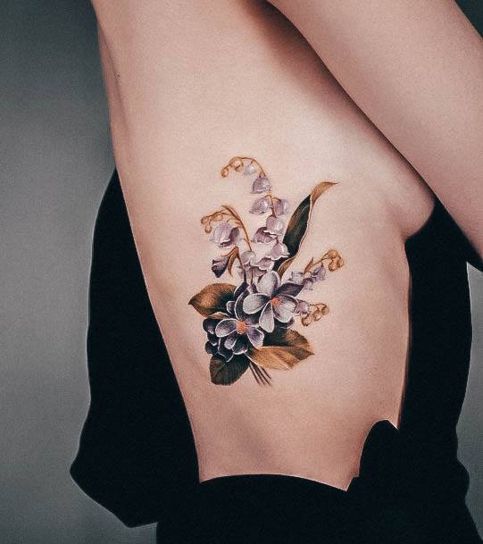 Decorative Lily Of The Valley Tattoo On Female