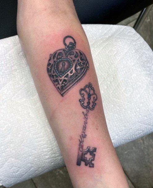 Decorative Locket Tattoo On Female