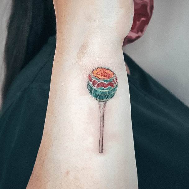 Decorative Lollipop Tattoo On Female