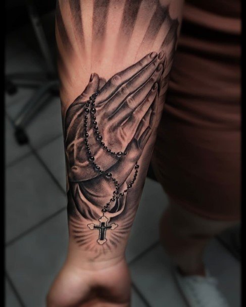 praying hands with rosary tattoo on chest