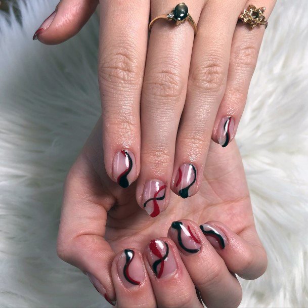 Decorative Maroon And Black Nail On Female