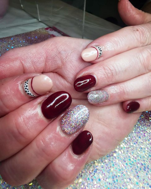 Decorative Maroon And Silver Nail On Female