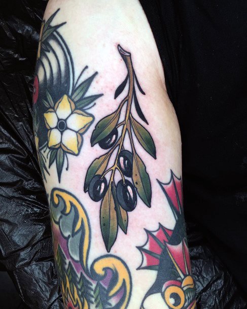 Decorative Olive Branch Tattoo On Female