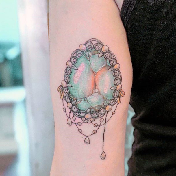 Decorative Opal Tattoo On Female