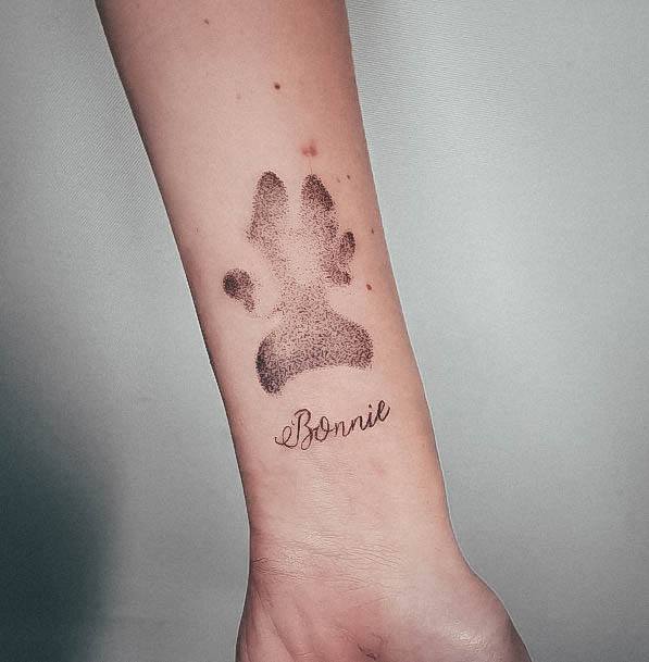 Decorative Paw Print Tattoo On Female Inner Forearm