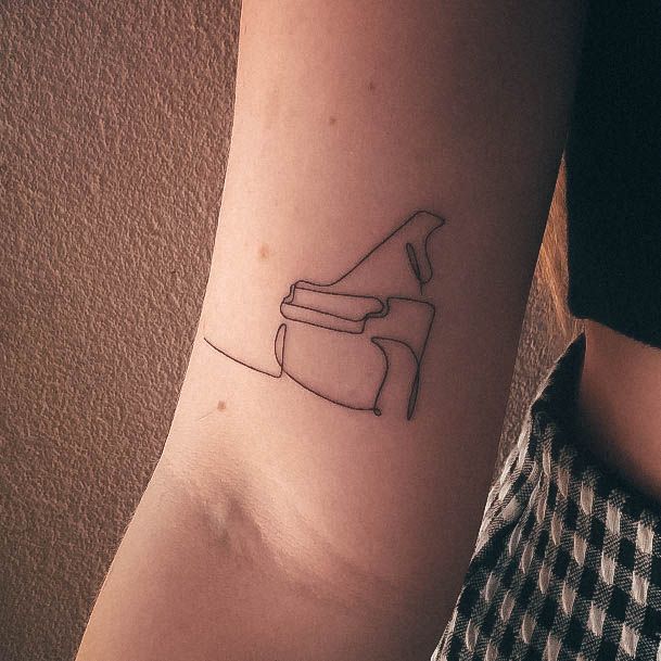 Decorative Piano Tattoo On Female