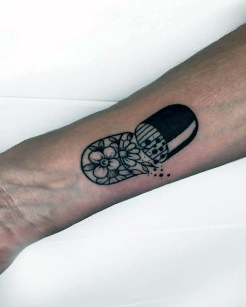 Decorative Pill Tattoo On Female