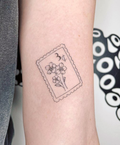 Decorative Postage Stamp Tattoo On Female